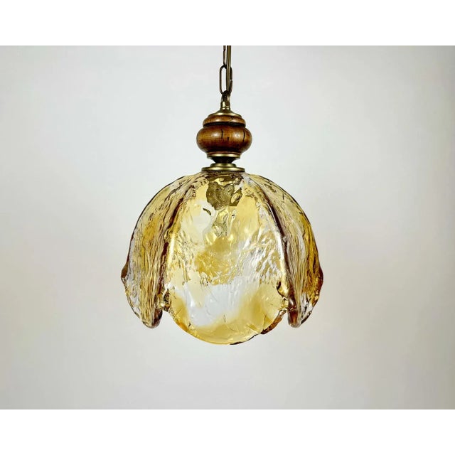 Thick murano glass chandelier designed by carlo nason for mazzega in the 1970s. the glass shade is made from textured...
