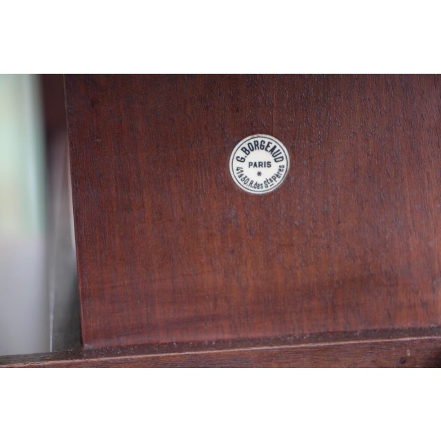 Rotating bookcase signed "G.borgeaud Paris" in very good condition This piece has an attribution mark, I am sure that it...