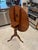 This tilt-top, birdcage table that spins and tilts is believed to be made of walnut. Manufacturer and exact date of...