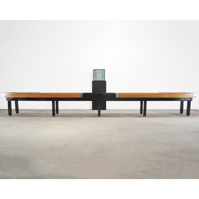 A monumental early to mid-20th century vintage Americana shuffleboard table measuring the official regulation and...