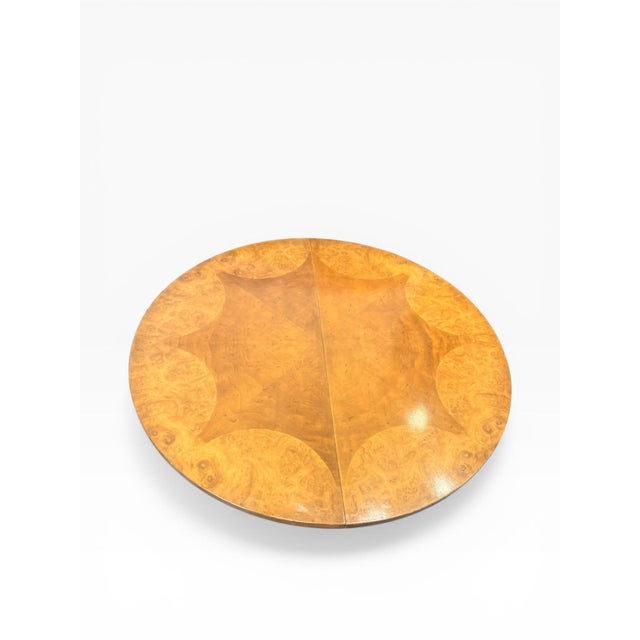 This elegant expandable dining table was produced by Mastercraft Furniture Company during the 1960s and showcases the...