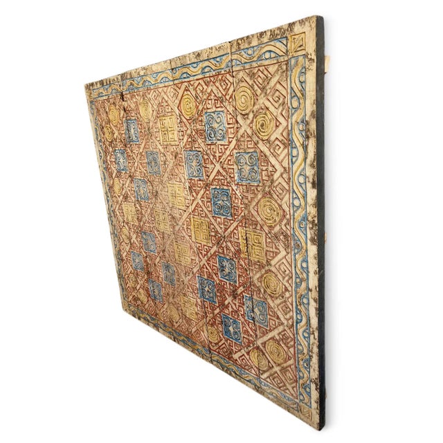 Original carved wood vintage tribal panels placed together in a square to create an interesting textural wall art piece....