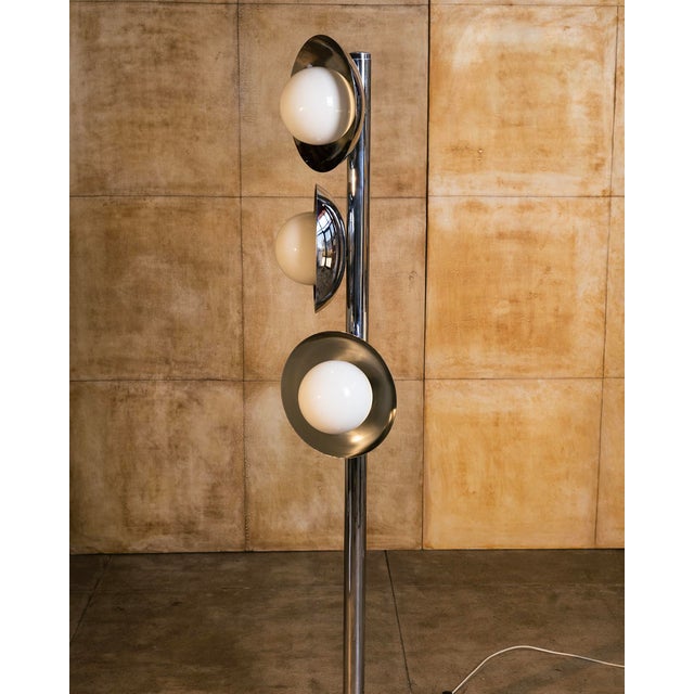 Italian lighting of the 1970s embraced the optimism of the Space Age, combining polished chrome, opaline glass, and...