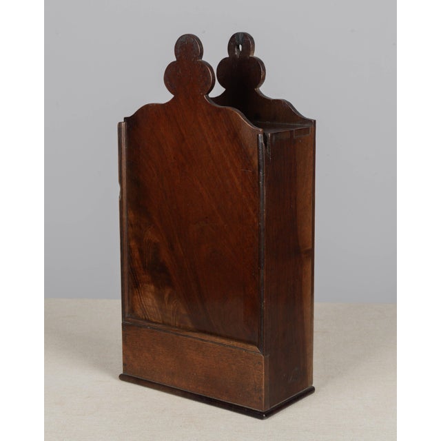 A 19th century French fariniere, made of walnut with simple clover leaf shaped top. Good craftsmanship with dovetailed...