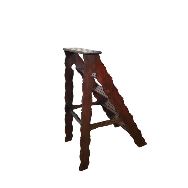 Wooden library ladder, ideal for displaying plants or decorative objects. The carved sides add character and refined...