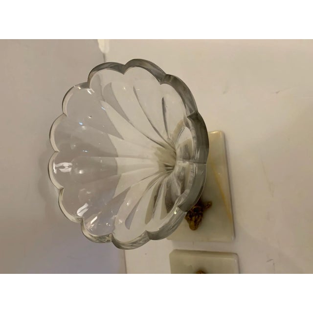 A beautiful pair of cut glass cornucopia or garniture having white marble bases and stunning bronze decorative rams heads.