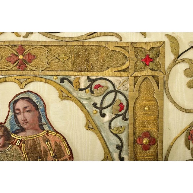 An impressive work of textile art, this French 19th century raised gold embroidery of the Madonna & Child resembles...