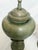 Bring sculptural elegance and earthy sophistication to your space with this identical pair of vintage green ceramic urn...