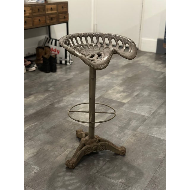 Set of five vintage cast iron bar stools by Baker & Hamilton, known for their early industrial designs and solid...