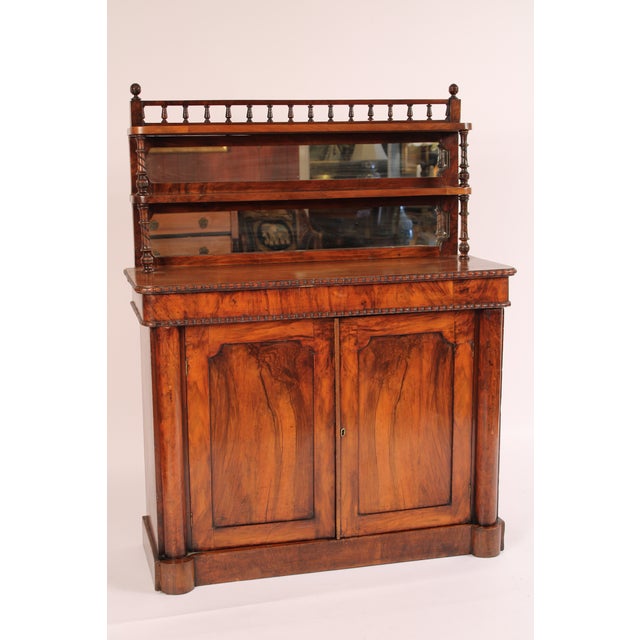 English regency two part rose wood chiffonier, early 19th century. In two parts, the top part with a bluster turned...