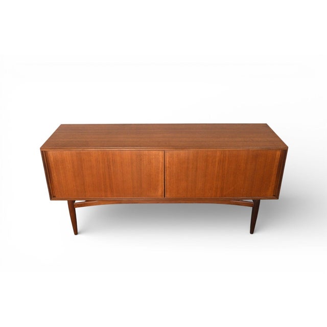 Origin: England Designer: G Plan Manufacturer: G Plan Era: 1966 Materials: Teak, Afromosia Measurements: 60" wide x 18"...