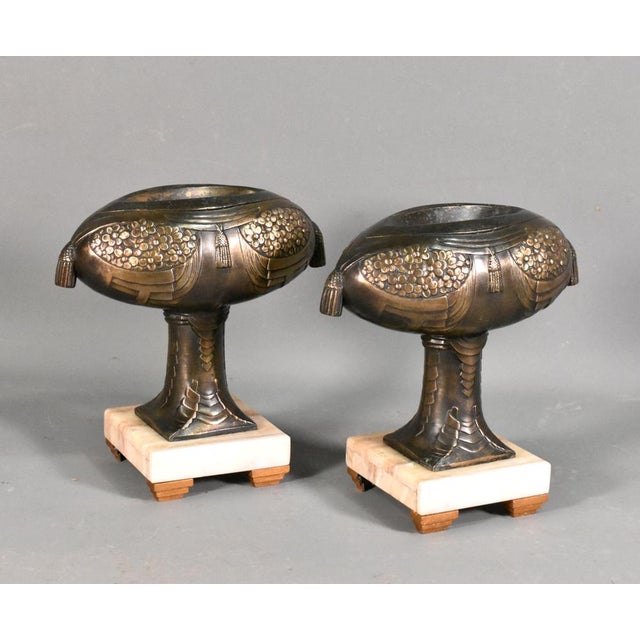 Pair of Decorative French Art Deco Garniture This unusual pair of garniture is decorated with floral motifs and swags of...