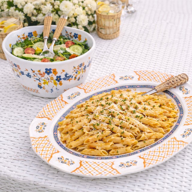 Infuse your dining experience with vibrant elegance through the Blooming Sunset Pagoda Melamine Serving Bowl. Featuring a...
