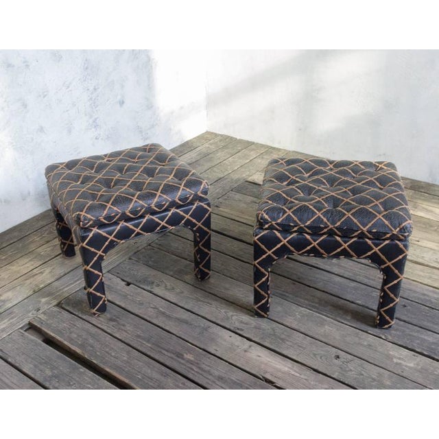 A unique pair of tufted square benches upholstered in embroidered black leather. Add a timeless touch of sophistication to...