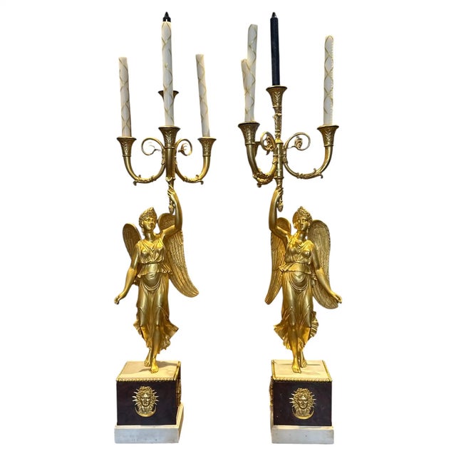 Pair of Grand Gilt Bronze and Marble Empire Candelabra. Each with a Winged Victory Holding a four arm trumpeted...