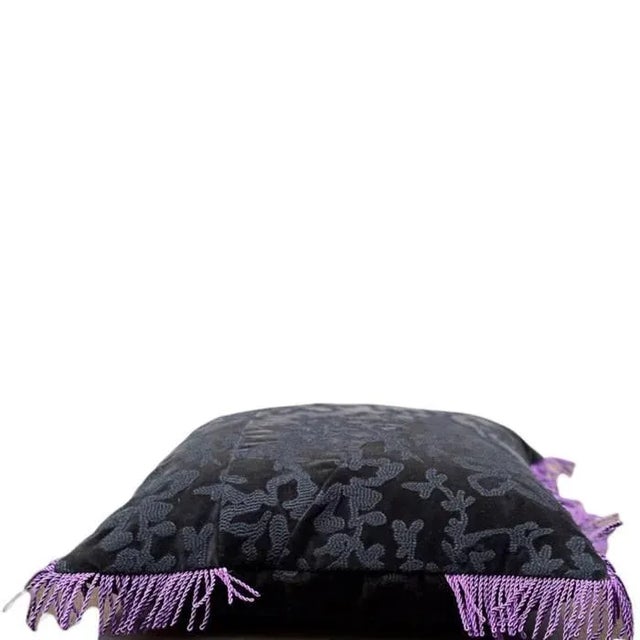 Black cotton velvet with floral embroidery composed in patchwork pattern on front and back side, decorated with a purple...