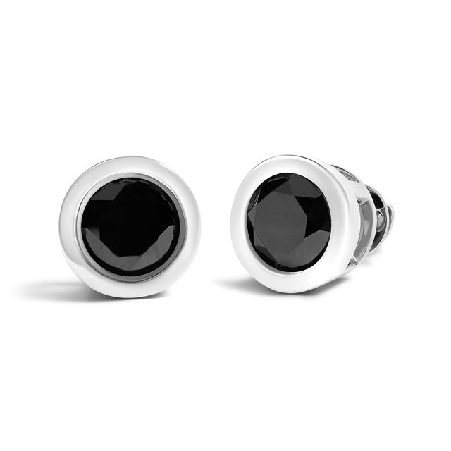 Elegant and timeless, these gorgeous .925 sterling silver solitaire stud earrings feature bold and beautiful heat treated,...