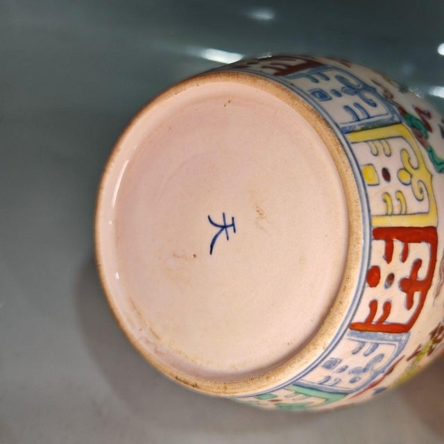 Beautiful Chinese wucai porcelain ginger jar with fitted domed lid, decorated with a vivid green dragon soaring among...
