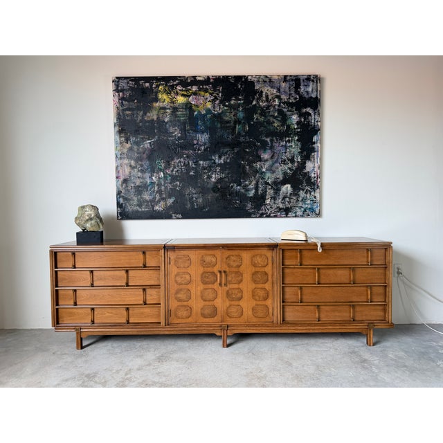 Bring timeless Mid Century Modern style to your home with this impressive Thomasville Tamerlane bar credenza. This long...