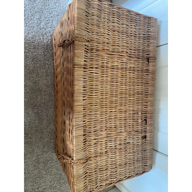 Beautiful large woven wicker storage chest with a hinged lid and braided loop closures. This sturdy basket features a warm...