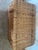 Beautiful large woven wicker storage chest with a hinged lid and braided loop closures. This sturdy basket features a warm...