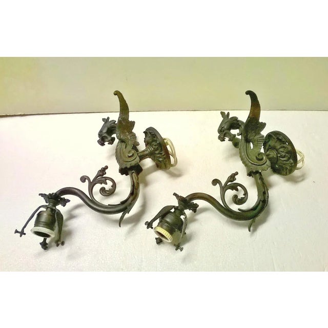 These Lamps in the Shape of winged dragon are very rare. They are in gilded bronze and have the original patina of time....