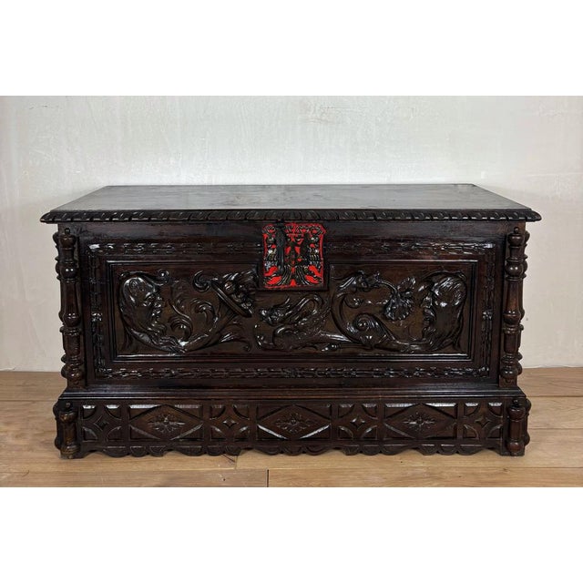Impressive Spanish blanket chest crafted in solid oak, richly decorated with deep hand-carved panels and striking...