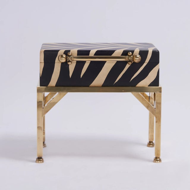 Standout pair of mid century boxes on stands having hand decorated faux vellum interiors, set on brass stands with custom...