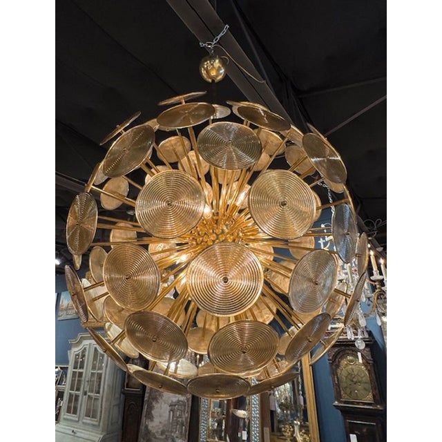 Impressive large scale Italian Murano glass and brass sputnik chandelier. A Murano Sputnik chandelier combines hand‑blown...