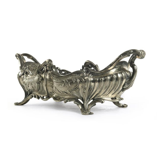silver metal Centerpiece of the late nineteenth century. This piece is designed in the style of the selected designer...