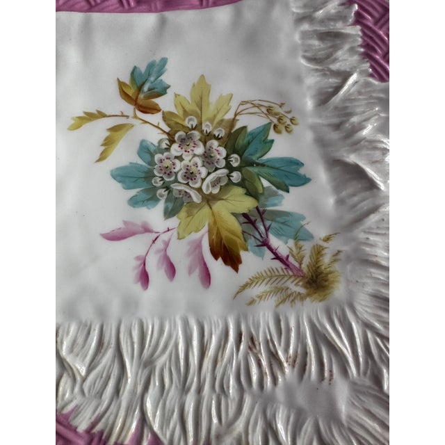 This exquisite vintage porcelain plate from EJ Bodley captures the elegance of Victorian trompe l’oeil artistry. Designed...