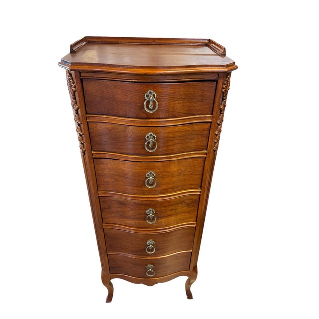 Elegant Lexington Furniture semainier crafted in richly figured cherry with graceful serpentine drawer fronts, carved...
