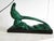 Green ceramic statuette on a black base, signed HL. Dimensions: 48.5 x 12.5 cm and 34 cm high. In the style of Saint...