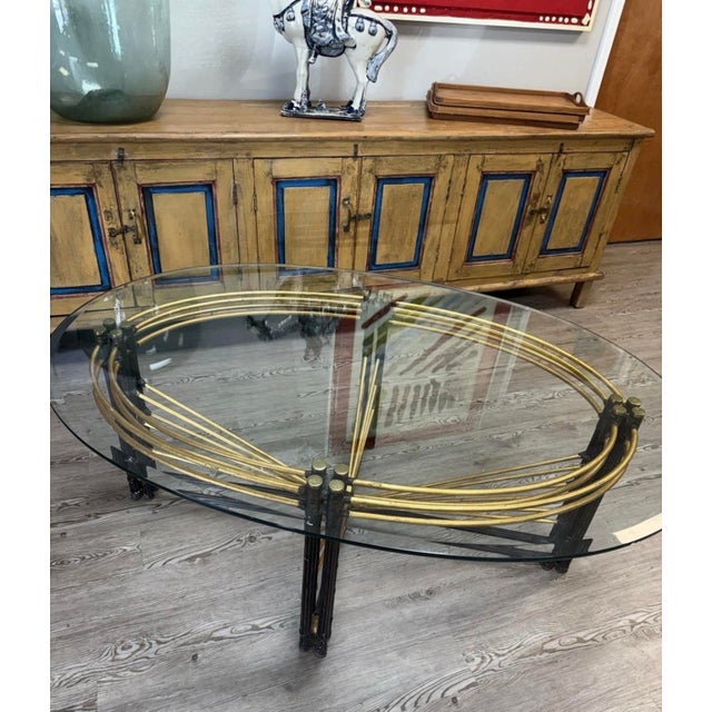 This Vintage Hollywood Gilt Metal and Glass Coffee Table with a Faux Bamboo Base exudes elegance and charm with its...
