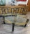 This Vintage Hollywood Gilt Metal and Glass Coffee Table with a Faux Bamboo Base exudes elegance and charm with its...