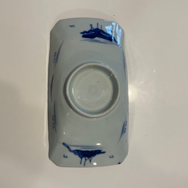 Antique Japanese porcelain Imari ware dish. Details Include landscape scene with mountains, water, and floral accents....