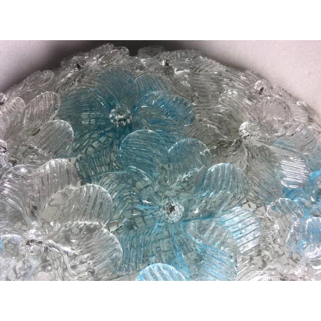 Charming ceiling light made with dozens of roses in blown glass, ice and blue. Three E14 light bulbs 40w. Up to 250V...