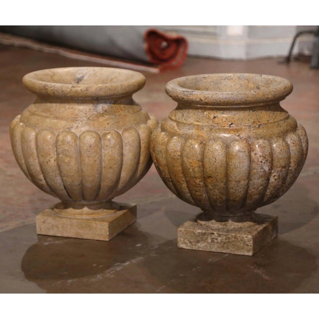 Crafted in Italy circa 1950 in the neoclassical style and made of hand carved granite, the antique planters have a...