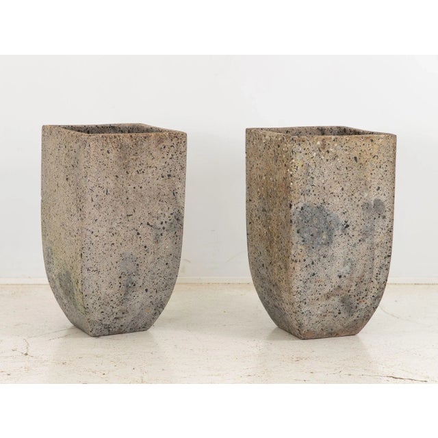 This striking pair of large planters draws inspiration from the bold aesthetics of brutalist design. Crafted with a fusion...