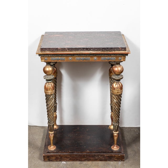 Beautiful, hand carved, painted and parcel-gilt 3 sided console table with tapered, spiral legs surmounted by a foliate...