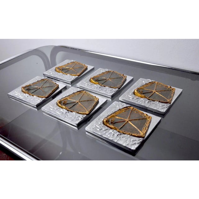 Very nice set of 6 brutalist coasters by art3, designed and produced in Spain in the 1970s. Objects in brass and aluminum,...