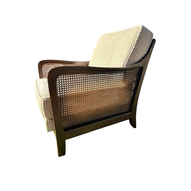 Rare labeled Knoll Antimott armchair with a woven cane surround, sculptural wood frame, and clean wide-wale corduroy...