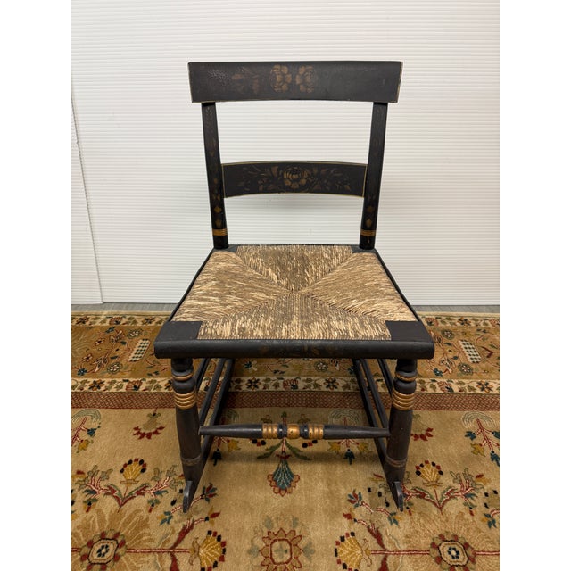 Design Plus Gallery presents an Ebonized Hitchcock Rocking Chair from the early 19th Century. Original black Hitchcock...