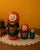 Charming vintage Russian-style Matryoshka nesting doll set of three, dating approximately to the 1960s–1970s. This...