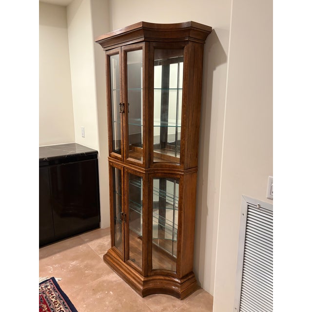 6’-2”H x 3’-3”W x 1’-4”D gorgeous burled walnut vitrine display case. Glass shelves. Doors are securely tight fitting.