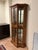 6’-2”H x 3’-3”W x 1’-4”D gorgeous burled walnut vitrine display case. Glass shelves. Doors are securely tight fitting.