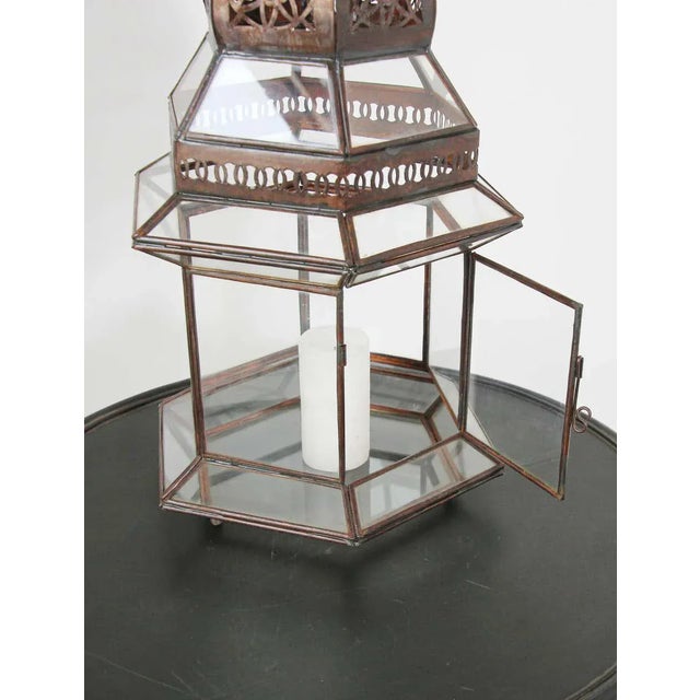 Large Moroccan metal and clear glass lanterns.Hurricane candle lamp in hexagonal shape with vintage rust color metal...