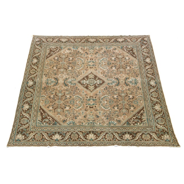 Beautiful Vintage Mahal hand-knotted wool rug with a brown color field. This Persian rug has classic blue and beige hues...