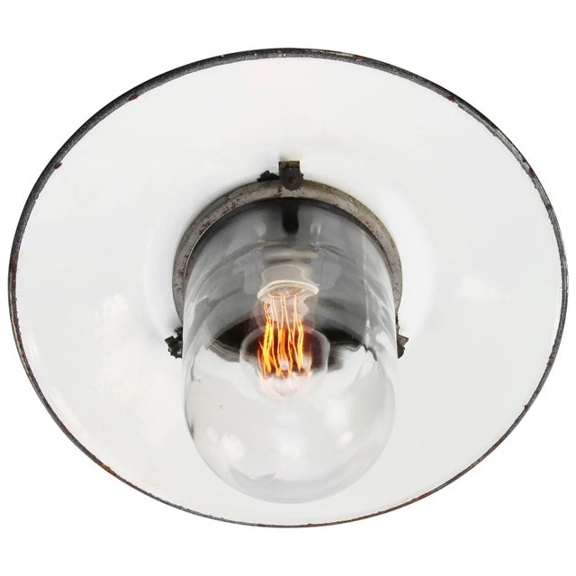 Industrial wall light. grey enamel, white interior. bakelite wall mount. clear glass. depending on destination, all our...