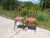 Pair of nearly identical chairs, made of solid beech with a dark oak stain. Fan-shaped spindle backrest with a curved...